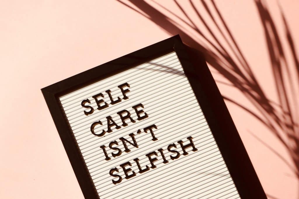 A letterboard that states "Self-care isn't selfish". This is a good reminder that you deserve self-care and that it helps you to have more capacity to help your foster/adoptive/kinship children.